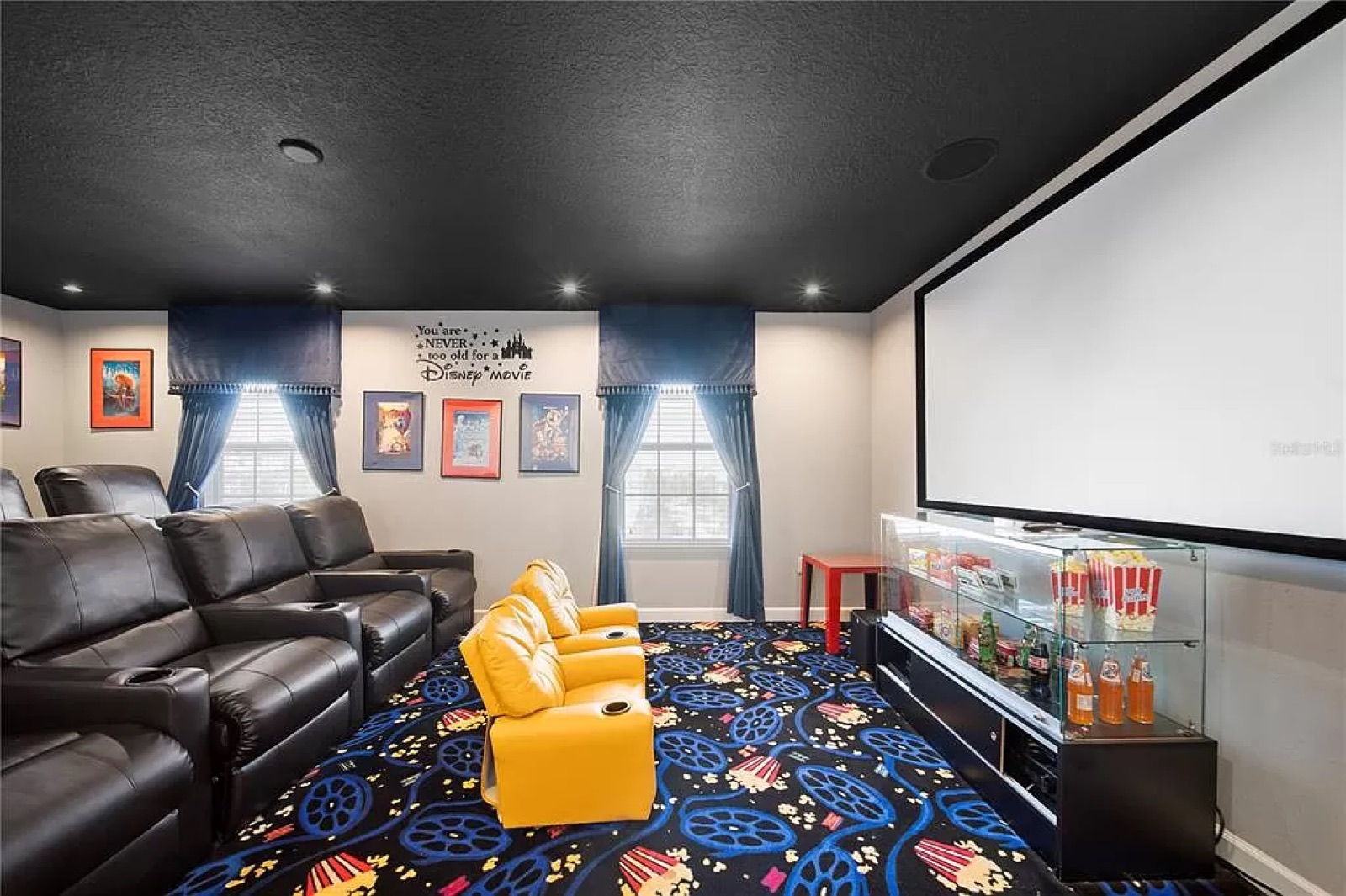 Home movie theater with screen and recliners
